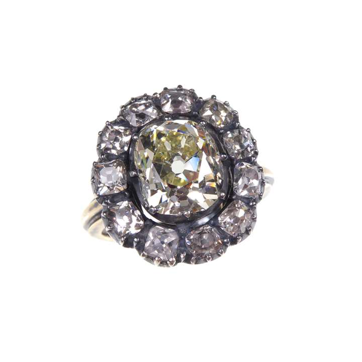 Antique diamond cluster ring, large central cushion cut diamond surrounded by 12 smaller diamonds, gold and silver set